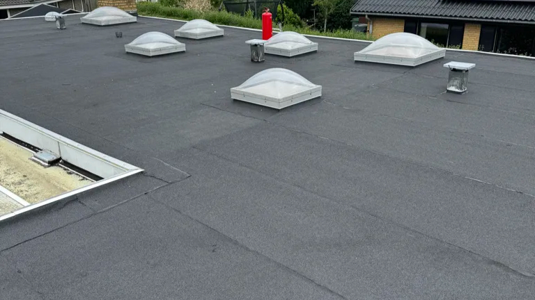 Nyt tagpaptag på Greve